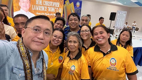 SENATOR Christopher 'Bong' Go poses with volunteer emergency responders during the National Convention of the Radio Emergency Communication Operation Network in Davao City.