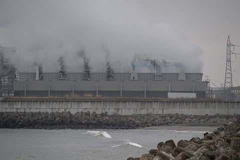 Steam rises out of a power station protected by a tsunami sea wall in Ishinomaki, Miyagi Prefecture on April 27, 2026. A strong earthquake rattled Japan's northern island of Hokkaido early on April 27, US and Japanese meteorological agencies reported, the latest in a series of powerful tremors to hit the island nation.