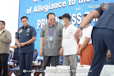 RPOC 3 Chairman Hermogenes E. Ebdane Jr. talks to a surrenderer during the Mass Withdrawal of Support and Oath of Allegiance to the Government ceremony held at the Multi-Purpose Hall, Camp Captain Julian Olivas in the City of San Fernando, Pampanga on April 27, 2026.