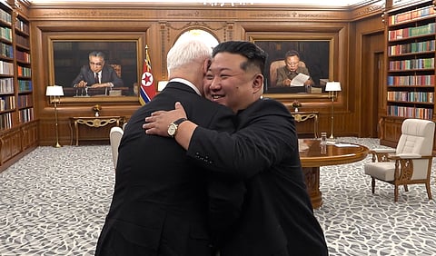 This video image grab taken from a handout footage released by the Russian Defence Ministry on April 26, 2026, shows Russian Defence Minister Andrey Belousov and North Korean leader Kim Jong Un embracing during a meeting in Pyongyang.