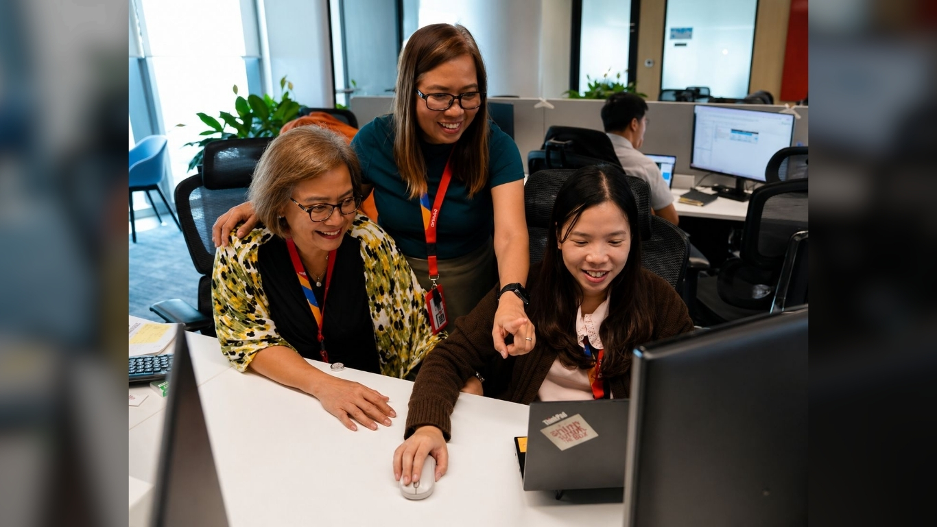 EMPLOYEES collaborate at an Aboitiz Group office, highlighting teamwork and a people-first culture.