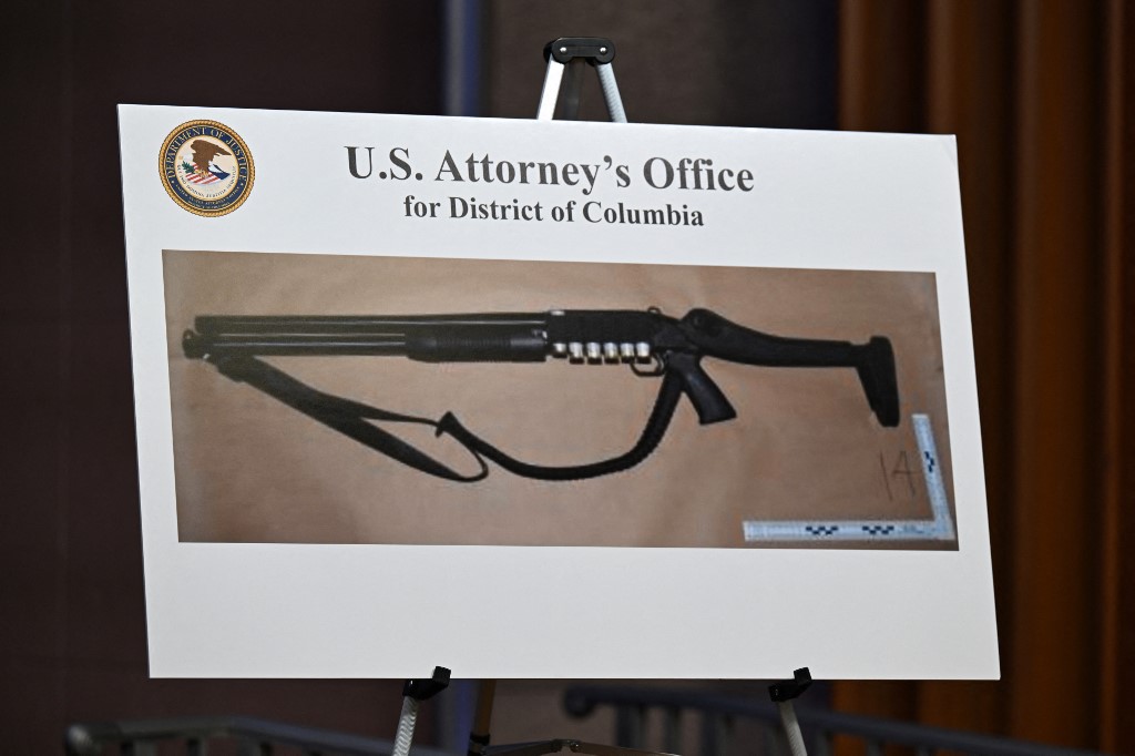 A firearm was displayed during a news conference at the Department of Justice headquarters on 27 April 2026, as authorities detailed charges against the man accused of the shooting at a media gala attended by President Donald Trump.