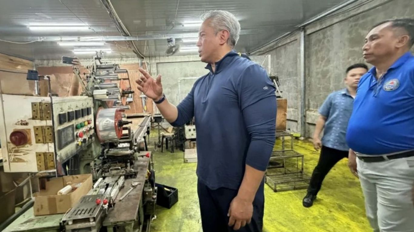 INTERIOR and Local Government Secretary Jonvic Remulla conducts a formal inspection of an illegal cigarette manufacturing facility discovered in Barangay Calumangan, Bago City. The operation was part of a national mandate to dismantle large-scale smuggling networks and protect local industries from illicit trade.