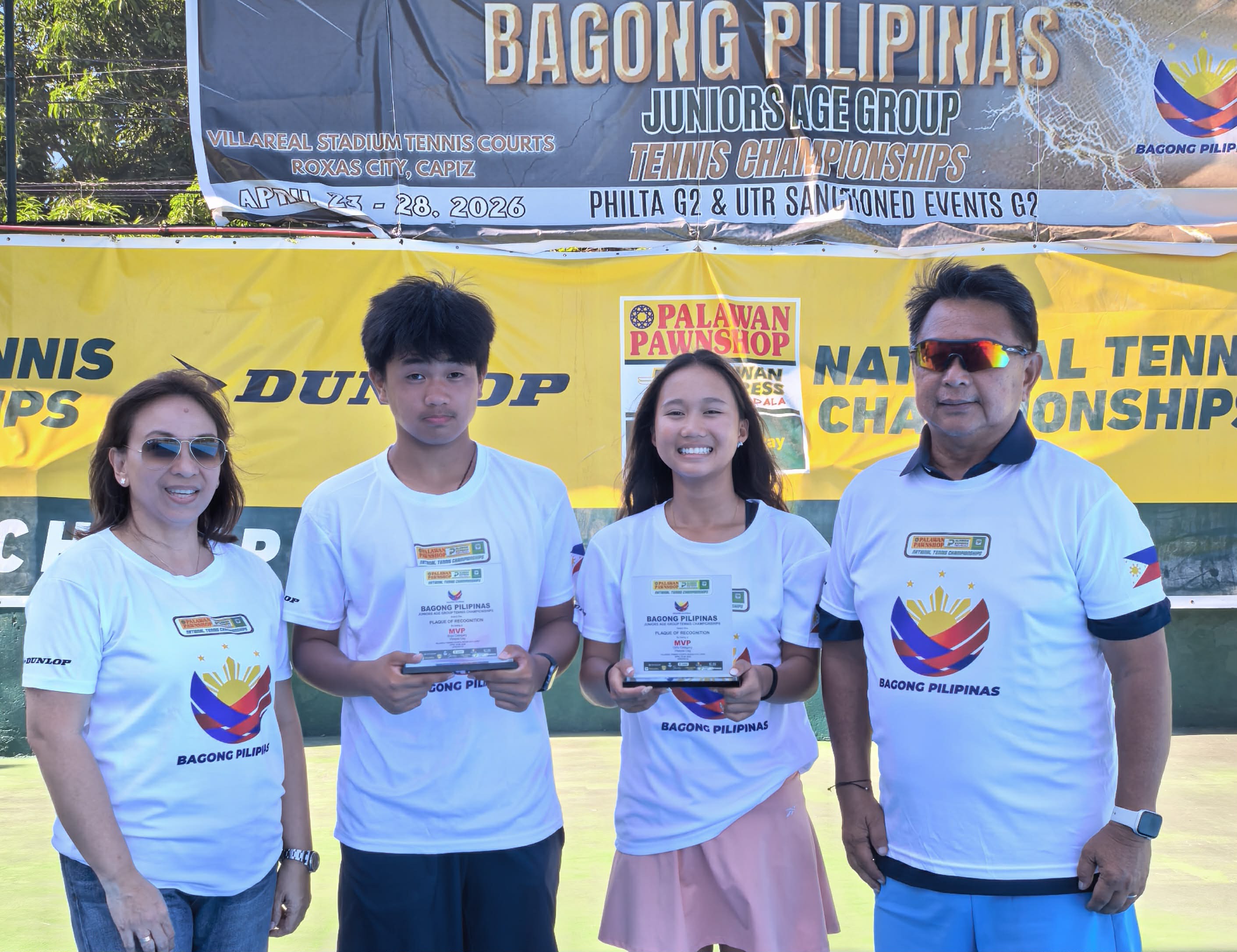 KATHLYN Bugna (third from left) shines anew, capturing three more titles, including two in singles, at the Bagong Pilipinas Junior tennis tournament and cementing her status as one of the country’s brightest young stars. Joining her are Tricel Martin, co-MVP Anthony Castigador, and coach Ronald Martin.