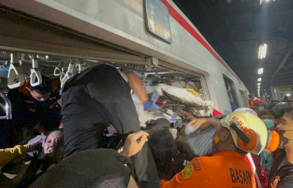 A passenger train locomotive crashed into the rear of a commuter train at Bekasi Timur Station in West Java. Rescue operations were ongoing early Tuesday, with responders still extracting victims from the wreckage.