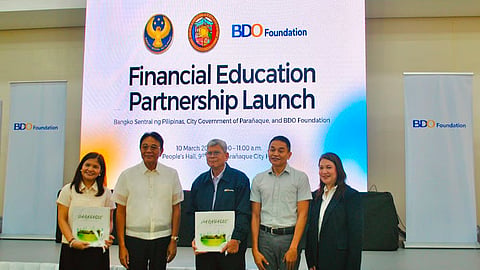 Representatives from Bangko Sentral ng Pilipinas, BDO Foundation, Parañaque local government and fisheries sector, witness the launch of the BSP-BDO Foundation-initiated financial education program at the Parañaque City Hall.