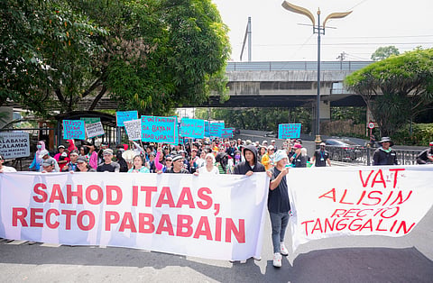 Residents of Batangas conducting a protest in Manila on Labor Day calling for the increase in minimum wage, VAT abolishment, and the removal of Finance Secretary Ralph Recto from his post.