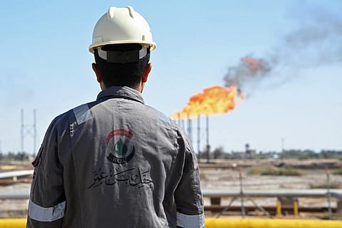 An employee of Basra Oil Company, inspects the Nahr Bin Umar Oil and Gas Field on the outskirts of the southern Iraqi city of Basra on April 29, 2026.