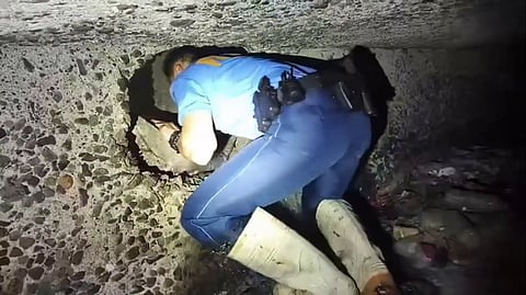 Operatives from QCPD Novaliches Police Station 4 discovered a tunnel allegedly dug by unidentified suspects to gain entry into a pawnshop in Brgy. Nova Proper, Quezon City. (Screenshot photo from QCPD)