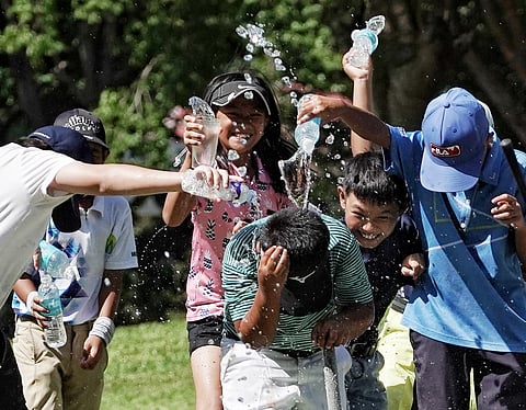 STEPHEN Clementer is drenched by fellow players in celebration after completing a thrilling comeback victory in the boys’ 7-10 crown in the ICTSI Pueblo de Oro Junior PGT Championship.