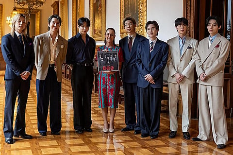Handout picture released by Mexico's presidency press office showing Mexico’s President Claudia Sheinbaum with South Korea's K-pop band BTS at the Palacio Nacional in Mexico City on 6 May, 2026. BTS will hold three sold-out shows at Estadio GNP Seguros in Mexico city on 7, 9, 10, May.