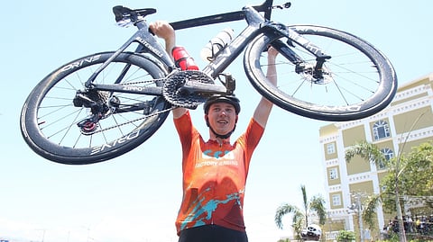 DANIEL Guld proudly lifts his bicycle after ruling Stage 9 of the MPTC Tour of Luzon on Friday.