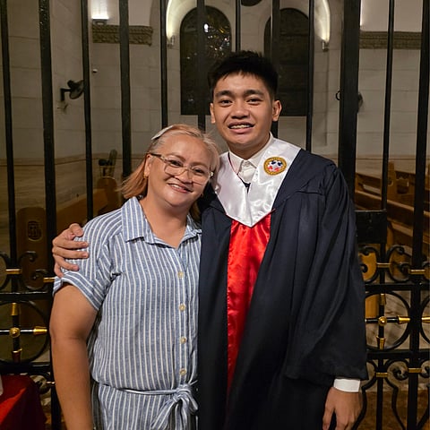 RHODA Orcullo (left) shares a moment with her writer-son, Jerod, during the latter’s graduation from Colegio de San Juan de Letran.