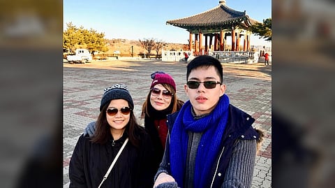 FATIMA (left), Jenina and Jason share a treasured family moment during their trip to South Korea in November 2017.
