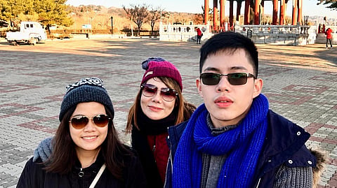FATIMA (left), Jenina, and Jason share a treasured family moment during their trip to South Korea in November 2017.