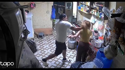 Cpl. dela Cruz beating her wife in a viral CCTV video May 10