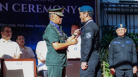 ARMED Forces of the Philippines Chief of Staff Gen. Romeo Brawner Jr. (left) presents an award to a graduate during the Customs Police Rapid Intervention Group-Special Operations Training graduation ceremony at the Bureau of Customs grounds in Manila. The program marks the successful completion of specialized tactical training for the bureau’s enforcement unit.