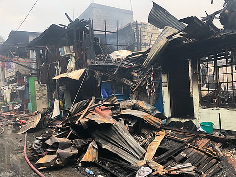 THURSDAY AFTERMATH: Around 9AM on 14 May, a residential area along East Riverside at Barangay Paltok, Quezon City was engulfed by fire which recorded one casualty. (PHOTOGRAPHED by Sean Magbanua for DAILY TRIBUNE)