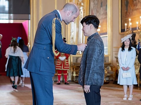 Filipino educator awarded MBE at Windsor Castle for school leadership