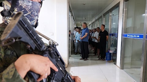 OPERATIONAL elements of the Presidential Anti-Organized Crime Commission and the Department of National Defense secure the Philippine Veterans Investment Development Corporation Industrial Authority compound in Tagoloan, Misamis Oriental.