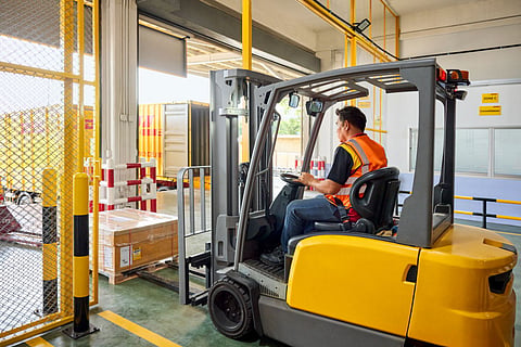 DHL Express personnel operate Heavy Weight Express, an express air solution for heavy cargoes, fortifying its role as a leading global integrator capable of moving heavyweight cargo to countries they serve with express speed and reliability.
