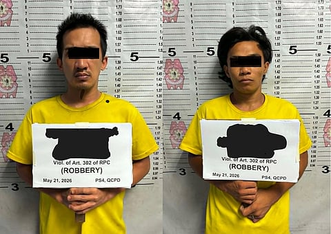 Mugshots of aliases "Kirk" and "Angenelle" who were arrested by authorities from the Quezon City Police District after robbing a lotto outlet in Barangay Bagbag, Novaliches, Quezon City on 20 May.