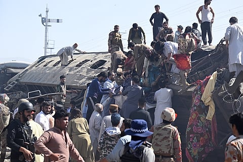 SECURITY personnel and residents rescue injured blast victims from derailed carriages after an explosion targeted a train in Quetta on 24 May 2026.