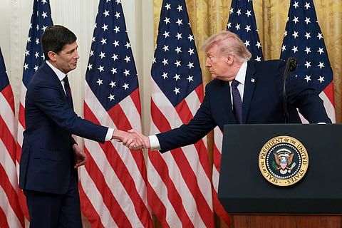 US President Donald Trump shakes hands with Kevin Warsh (left) at the swearing-in ceremony. Warsh succeeds Jerome Powell, who served for eight years.