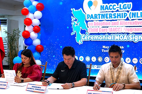 RACCO VIII Officer Josamae Sedillo, Tacloban City Mayor Alfred Romualdez, and NACC Assistant Secretary Erickson C. Luz sign the NACC-LGU Partnership Memorandum of Agreement.