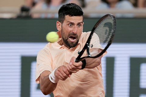 NOVAK Djokovic completes a come-from-behind 5-7, 7-5, 6-1, 6-4 win over Giovanni Mpetshi Perricard in the opening round of the French Open men’s singles event.