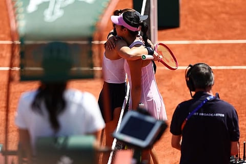 ALEX Eala and Iva Jovic share a hug at centercourt following an opening round encounter in the French Open on Tuesday.