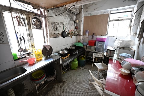 HK’s other face A kitchen is shared in a subdivided housing unit in Kowloon, Hong Kong. Chinese President Xi Jinping has ordered Hong Kong to resolve its housing woes that are the result of decades of pervasive inequality, an acute housing shortage, and eye-watering rents. Subdivided flats, created by splitting an apartment into smaller units, are being phased out after a new law regulating them came into effect in March.