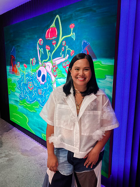 IN her debut solo exhibition titled ‘Glowing at the Seams,’ Benildean design graduate Angeli Henares Esguerra showcases a visual diary of emotional growth and personal transition through 11 vibrant pop-surrealist works.