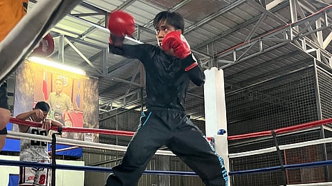 KENNETH Llover gets premium pointers from two-division world champion Gerry Peñalosa during his training camp in Tagaytay City.