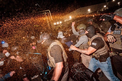 Clashes mar protests at immigration
detention center