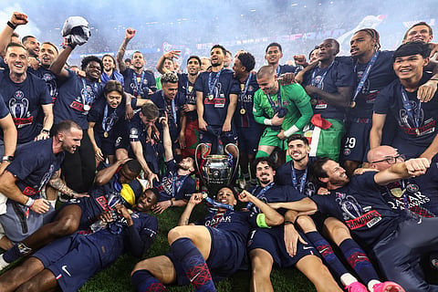 Paris Saint-Germain players celebrate after winning the UEFA Champions League final football match between Paris Saint-Germain (PSG) and Arsenal FC at the Puskas Arena in Budapest on 30 May 2026.