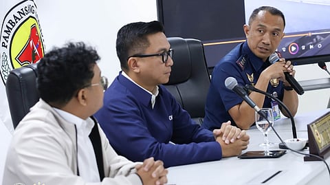 NATIONAL Police Commission commissioner Ralph Calinisan (center) leads the presentation of motovlogger Kean James Brul, known online as ‘Sir Ki’ (left) after a viral video showed him allegedly fleeing a Highway Patrol Group officer.