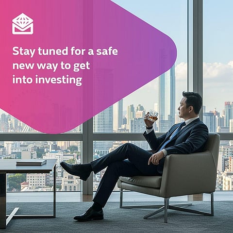 A professional reflects on his financial goals while overlooking the Makati skyline.