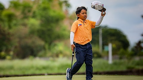 ZOJI Edoc heaves a sigh of relief after holing three straight pars to finish with a one-over par 72 and capture the boys 7-1 division crown of the ICTSI Beverly Place Junior PGT Championship on Tuesday.