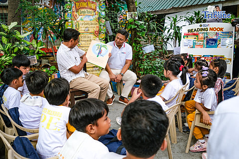 President Ferdinand Marcos Jr. and DepEd Secretary Sonny Angara read the Filipino children's book "Ang Pagong at ang Matsing" to students of Kapitbahayan Elementary School in Navotas City on Tuesday.