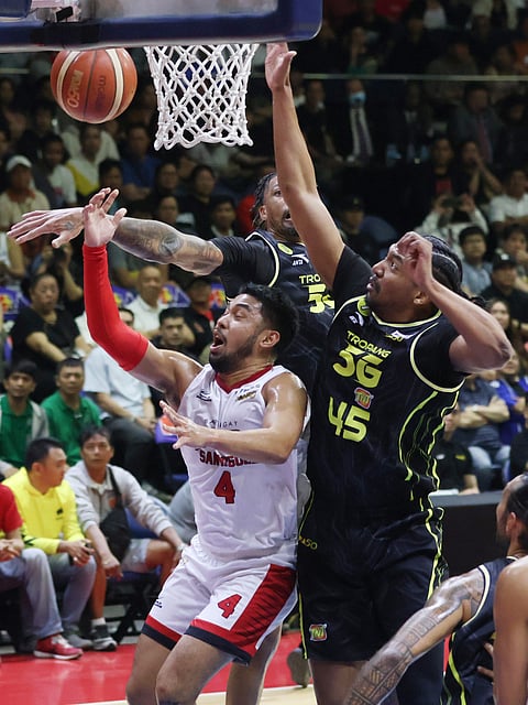RJ Abarrientos of Barangay Ginebra gets smothered by TNT Tropang 5G defenders during Game 2 of their PBA Season 50 Commissioner’s Cup best-of-seven finals series last Friday. The Tropang 5G won, 101-94.