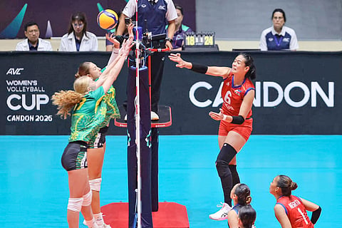 ALYSSA Solomon penetrates the defense of two Australian blockers during their AVC Women’s Volleyball Cup game on Sunday. The Filipinas lost, 22-25, 25-23, 25-18, 15-25, 11-15.