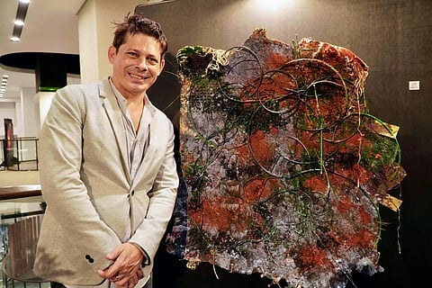 DAVID Kaufman with his painting.