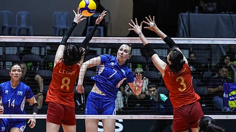 Yuliya Fomenko bangs in a kill past Vietnam’s Thi Thanh Thuy Tran (No. 3) and Thanh Thuy Le as Kazakhstan scores a five-set escape to complete a five-game sweep in Pool B of the 2026 AVC Women’s Volleyball Cup.