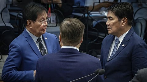 SENS. Ping Lacson (left) and Erwin Tulfo (right, background) confer during a Senate session, with Sen. Migz Zubiri.