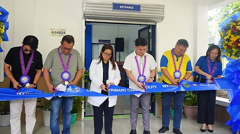 LEGANES Primary Care Facility OIC Dr. Michelle Jaen Krafft and BDO Network Bank branch head Marco Hugolino Casiple (center), lead the ceremonial ribbon cutting for the upgraded LPCF in Poblacion, Leganes, Iloilo on 11 June 2026.