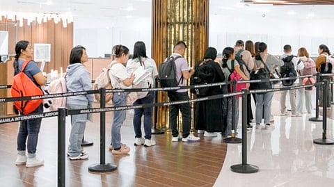 OVERSEAS Filipino workers line up at the new Immigration Annex and Lounge at the NAIA Terminal 3. The Bangko Sentral ng Pilipinas said OFW remittances in April reached $2.72 billion in April, improving 0.4 percent from $2.67 billion in March.
