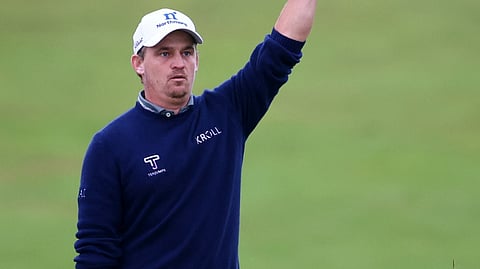 BUD Cauley raises his club after capturing his first PGA Tour title following a masterful win at the Canadian Open in Toronto.