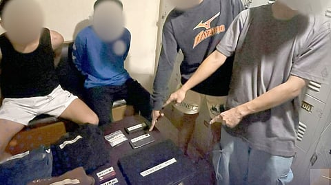 MANDALUYONG police officers present two robbery suspects who stole Honda Click motorcycle and a cache of stolen electronics, including a laptop and iPhones following a tracking operation on Thursday.