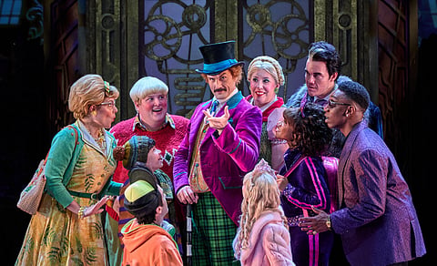 Michael Dalke, Oliver Wong, and the Charlie and the Chocolate Factory Cast at the Factory Doors
